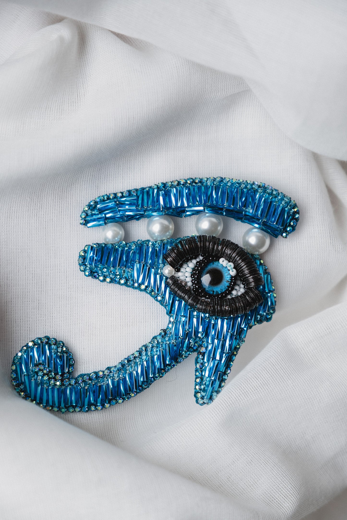 Symbolic eye brooch