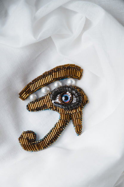 Symbolic eye brooch