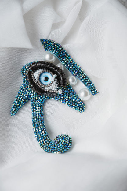 Symbolic eye brooch